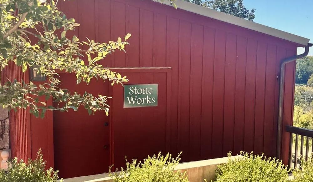 Red building with a sign reading "Stone Works."